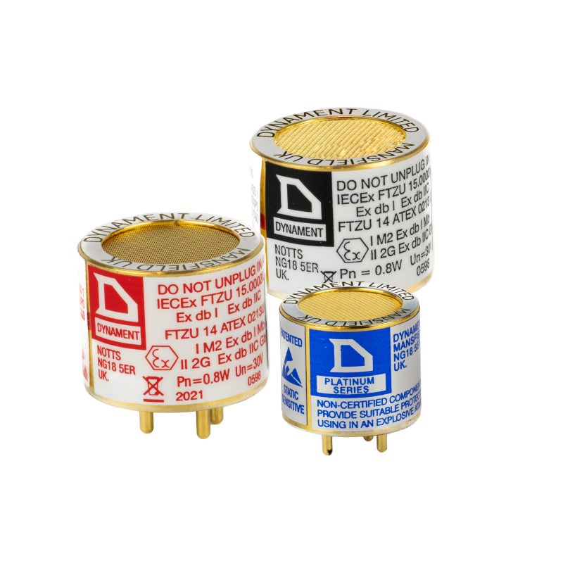 Image of a dual-gas infrared sensor module for detecting hydrocarbons and carbon dioxide, featuring a compact design with visible optical components and electronic circuitry.