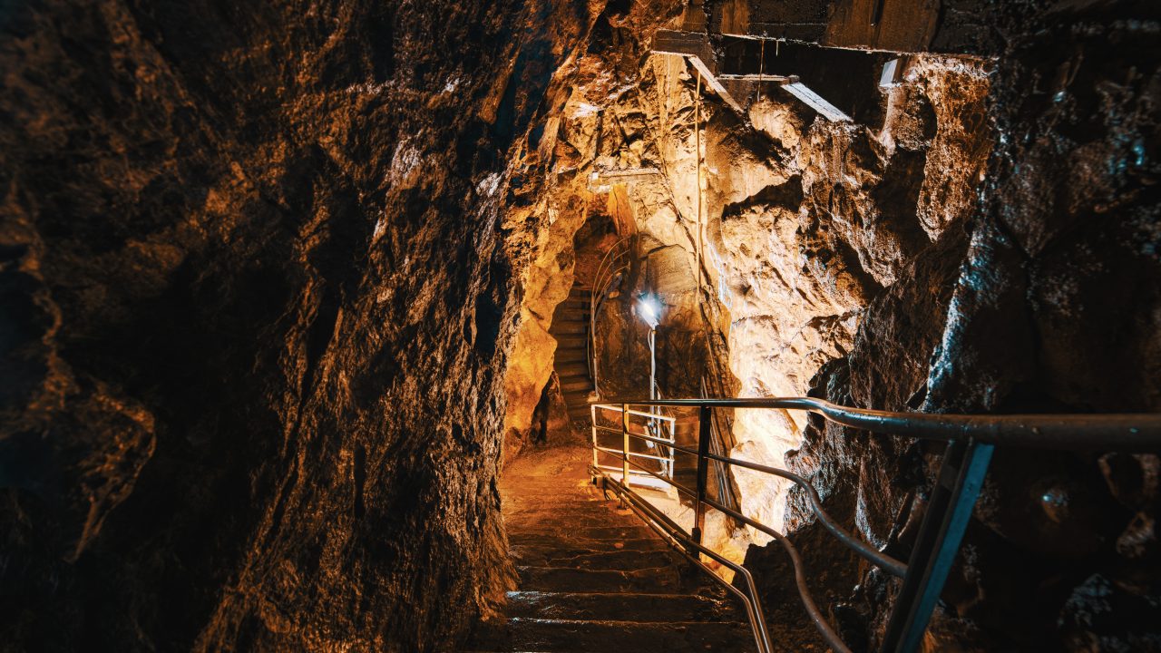 Underground limestone cave tunnel interior illustrating underground mining environment