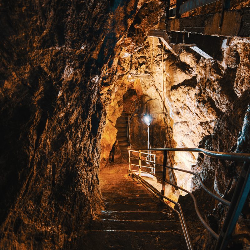 Underground limestone cave tunnel interior illustrating underground mining environment