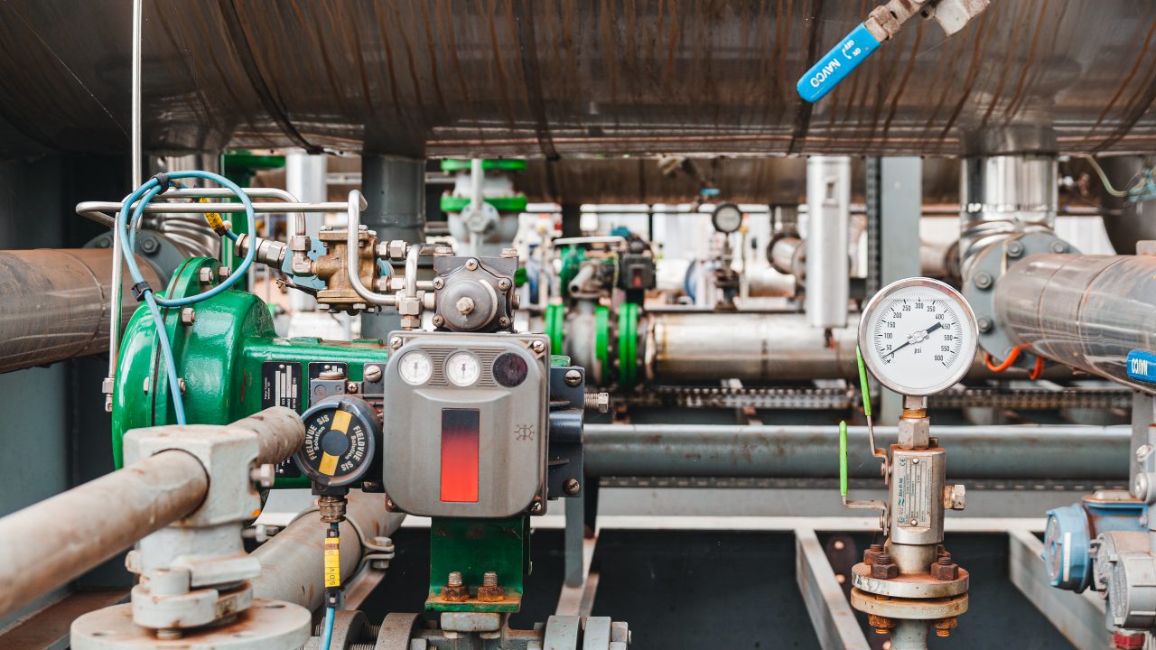 Industrial gas system with pipelines, valves and pressure gauges, representing OEM gas detection using dual‑gas NDIR sensors for industrial safety monitoring.